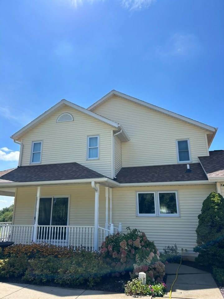 The same upper storey siding washed clean and even after a soft wash